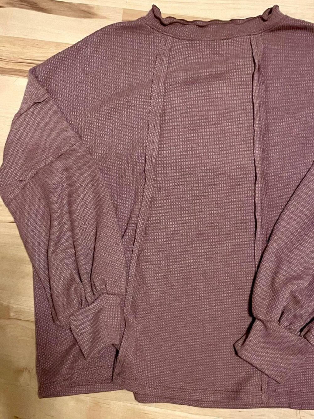 NWOT brown knit top with cute exposed-seam details. Medium.